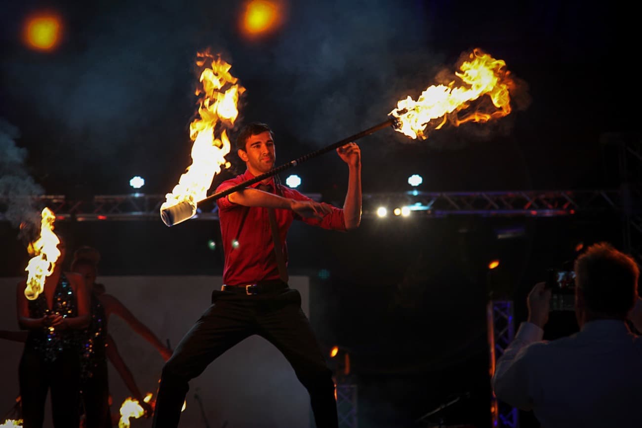 Fire Juggler twirls his fire batons