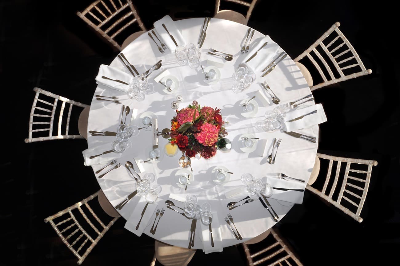 Round table set for a party viewed from above