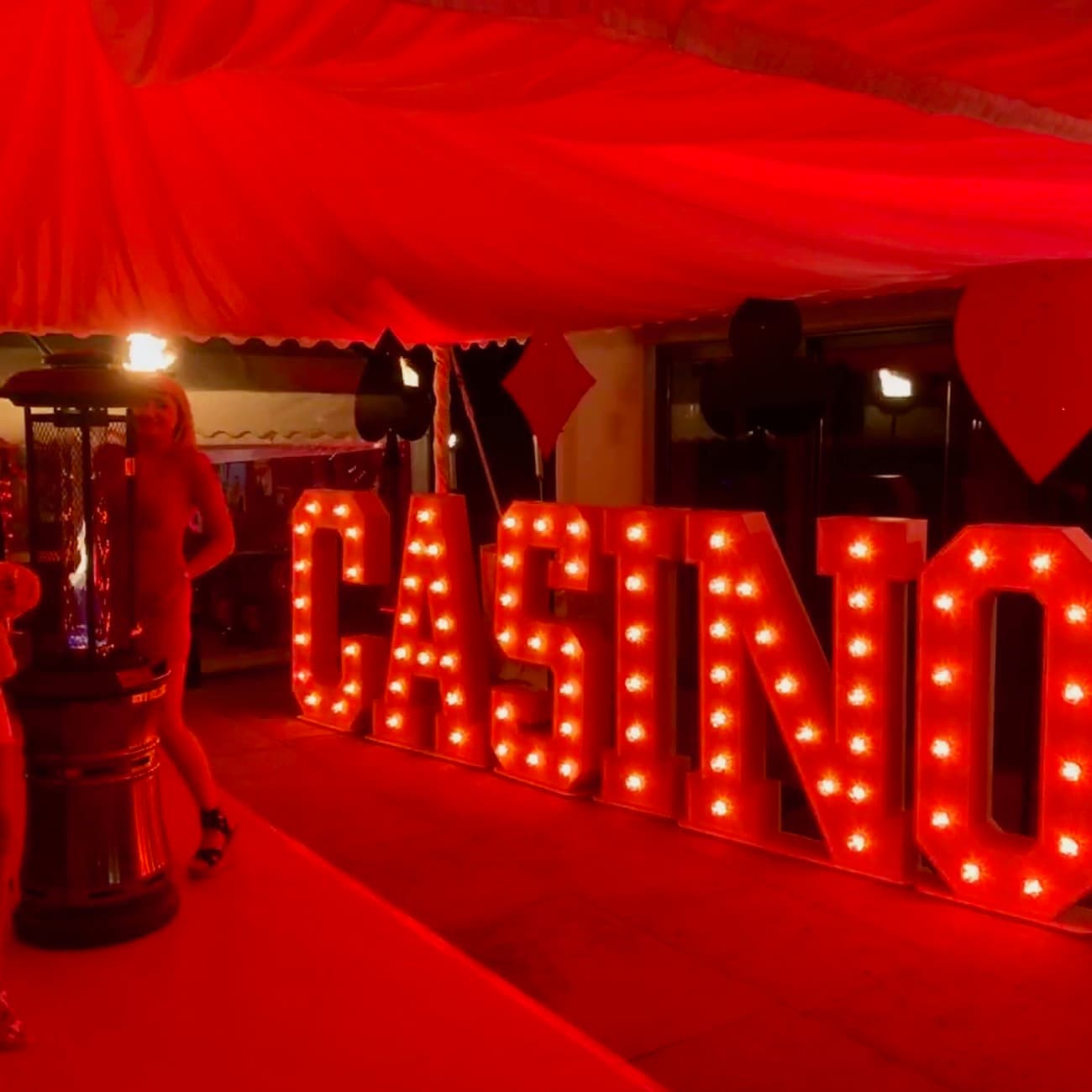 Casino light up letters in a party marquee