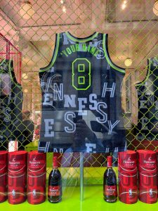 A NBA basketball jersey in the window of Selfridges with "your name" written on it.