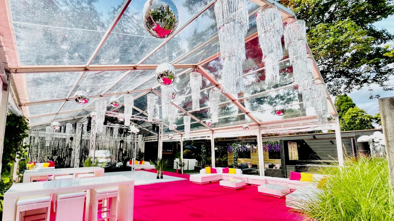 Marquee party with an ibiza theme and many mirror balls
