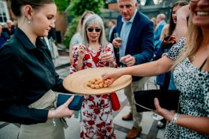 Tedstone 50 Garden party guests being served canapes