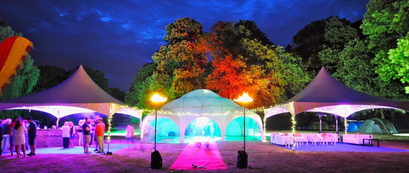 Two pagoda marquees and a Dome marquee sit at the end of a red carpet
