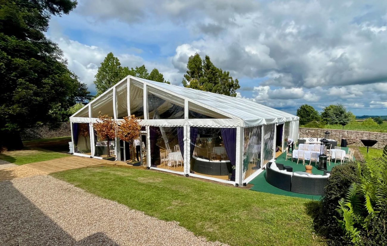 Tennis court marquee sat perfectly on the tarmac surface of an old tennis court.