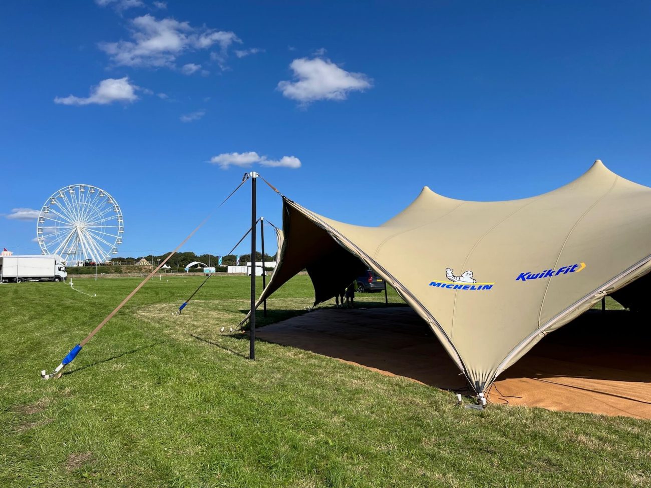 Stretch Marquee with branding on a sunny day. 